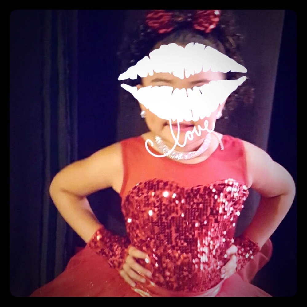 Stunning red sequence performance dress.